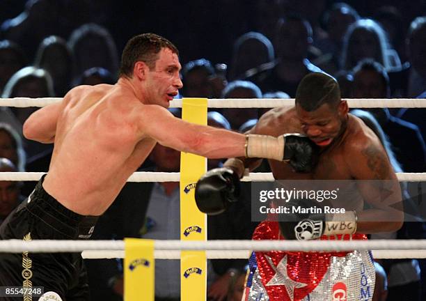 Vitali Klitschko of the Ukraine and Juan Carlos Gomez of Cuba exchange punches during their WBC World Championship Heavyweight at the...