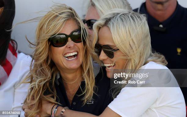 Tabitha Furyk, wife of Captain's assistant Jim Furyk of the U.S. Team, and Amy Mickelson, wife of Phil Mickelson of the U.S. Team, look on during...