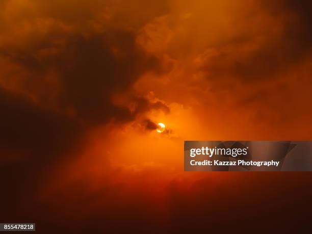sun in the middle of clouds - dark sky stock pictures, royalty-free photos & images