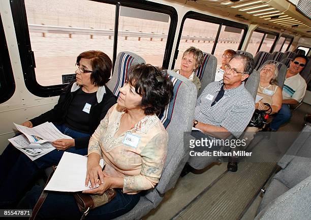 Prospective buyers including Liz Archuleta and Viola Aragon, both of New Mexico, take a RE/MAX Central bus tour of foreclosed homes March 21, 2009 in...