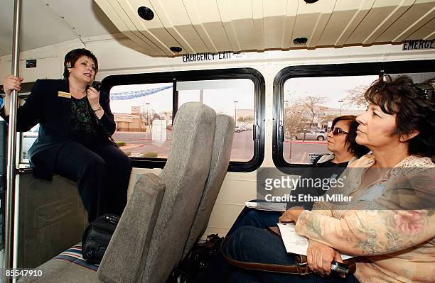 Max Central realtor Brenda Zablockis leads prospective buyers including Liz Archuleta and Viola Aragon, both of New Mexico, on a RE/MAX Central bus...