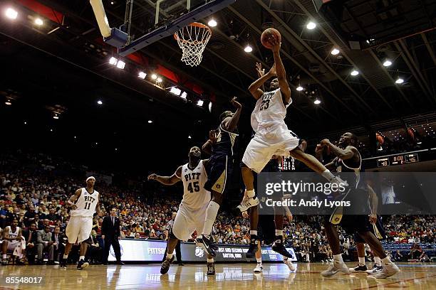 Sam Young of the Pittsburgh Panthers drives to the hoop against the East Tennessee State Buccaneers during the first round of the NCAA Division I...