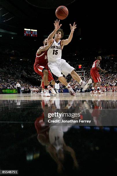 Matt Bouldin of the Gonzaga Bulldogs goes to catch the ball as he is covered by Sergio Kerusch of the Western Kentucky Hilltoppers during the second...