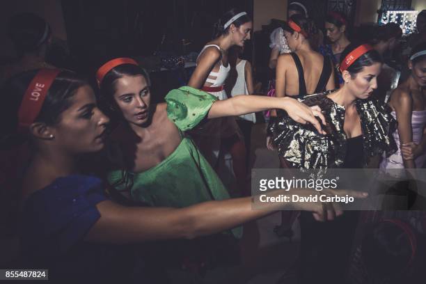 Models pose backstage of the catwalk Code 41 Trending Day on September 29, 2017 in Seville, Spain.
