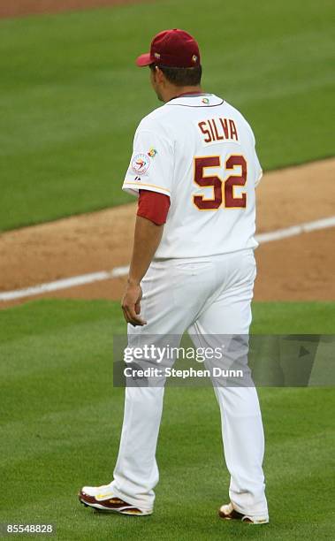 Starting pitcher Carlos Silva of Venezuela walks off the field after being relieved in the second inning of the semifinal game against Korea of the...