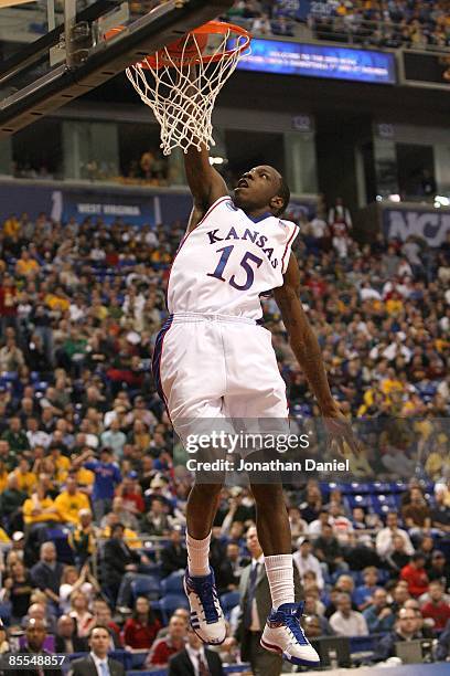 Tyshawn Taylor of the Kansas Jayhawks dunks against the North Dakota State Bison during the first round of the NCAA Division I Men's Basketball...