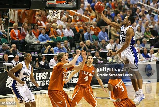 Gerald Henderson of the Duke Blue Devils lays in a basket against A.J. Abrams and Clint Chapman of the Texas Longhorns during the second round of the...