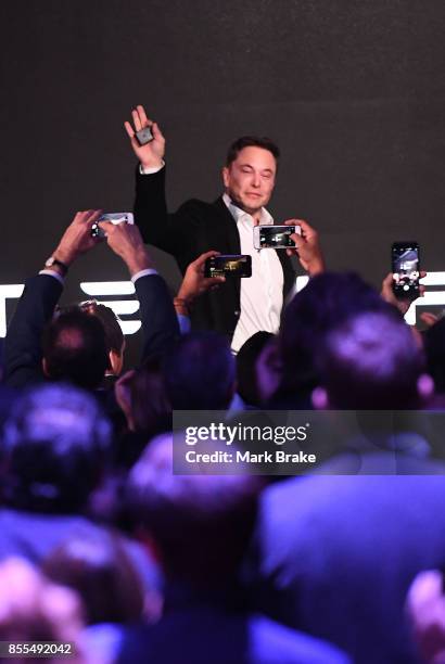 Elon Musk waves to the crowd as he finishes his presentation during Tesla Powerpack Launch Event at Hornsdale Wind Farm on September 29, 2017 in...