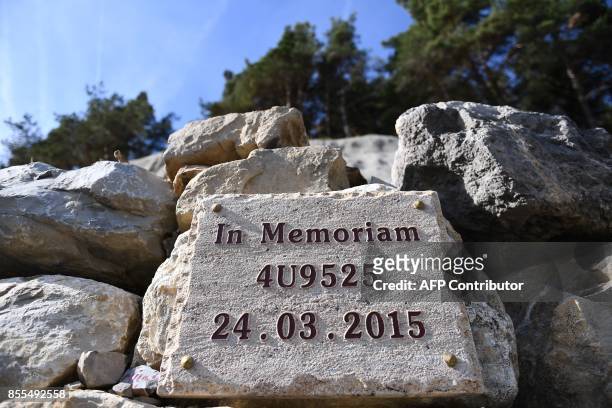 Picture taken on September 29, 2017 above the southeastern town of Seyne-Les-Alpes, shows a plaque at a viewpoint overlooking the "Sonnenkugel"...