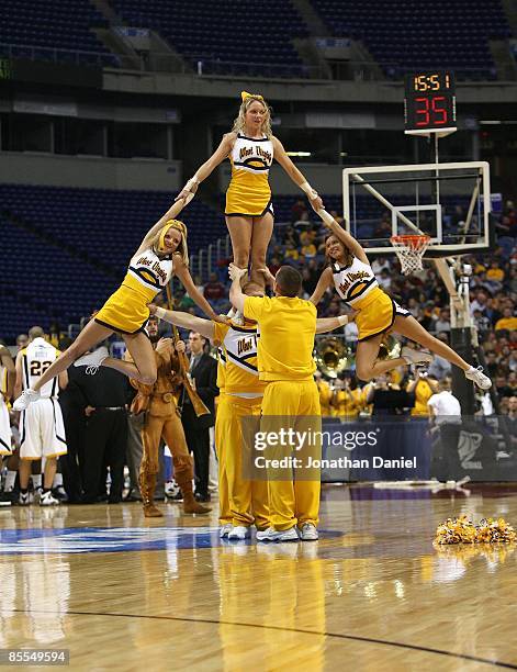 Cheerleaders for the West Virginia Moutaineers perform against the Dayton Flyers during the first round of the NCAA Division I Men's Basketball...