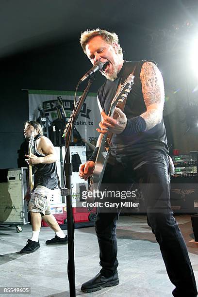 Musicians Robert Trujillo and James Hetfield of Metallica perform at a secret show celebrating the release of Activision's "Guitar Hero: Metallica"...