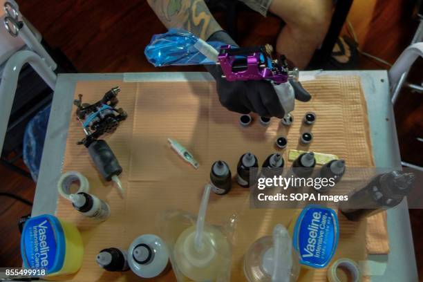 Gary Jones is seen while preparing the tattoo equipment and hygiene apparatus before the customer arrive in his studio. Gary Jones is one of the...