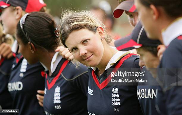 Nicky Shaw of England stands and embraces team mates after winning the ICC Women's World Cup 2009 final match between England and New Zealand at...