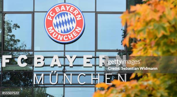 The Logo of FC Bayern Muenchen is seen behind fall foliage at Saebener Strasse training ground on September 29, 2017 in Munich, Germany.