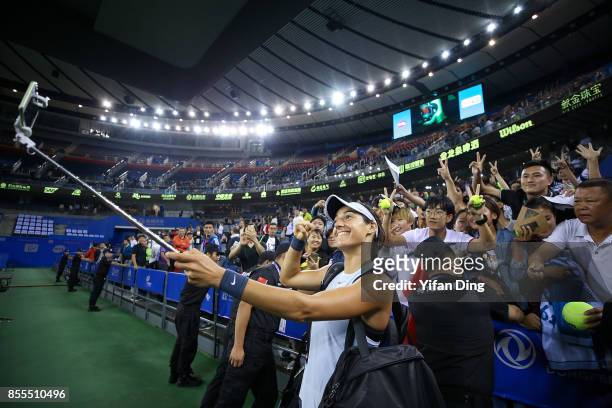 Caroline Garcia of France takes selfie with fans after winning the Ladies Singles semi final match between Maria Sakkari of Greece and Caroline...