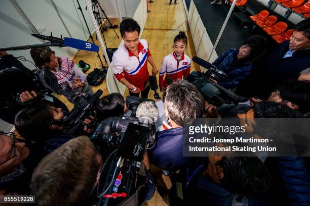 Tae Ok Ryom and Ju Sik Kim of DPR Korea speak to the media after the Pairs Free Skating during the Nebelhorn Trophy 2017 at Eissportzentrum on...