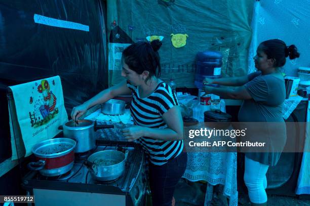 Members of the Workers Without Roof Movement cook at the Povo sem Medo camp in which live about 7,000 families, in Sao Bernardo do Campo, 25 km south...