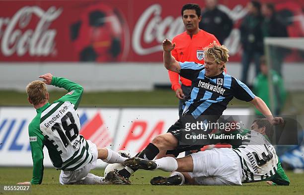 Sascha Roesler of 1860 battles for the ball with Leonhard Haas and Asen Karaslavov of Fuerth during the second Bundesliga match between Greuther...