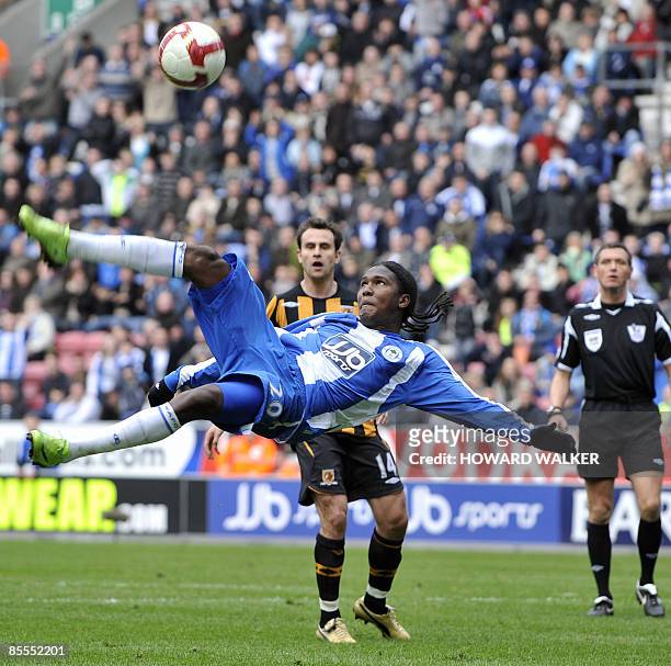 Wigan's Hugo Rodallego kicks the ball during their English Premiership football match against Hull at The JJB Stadium, north-west England on March...
