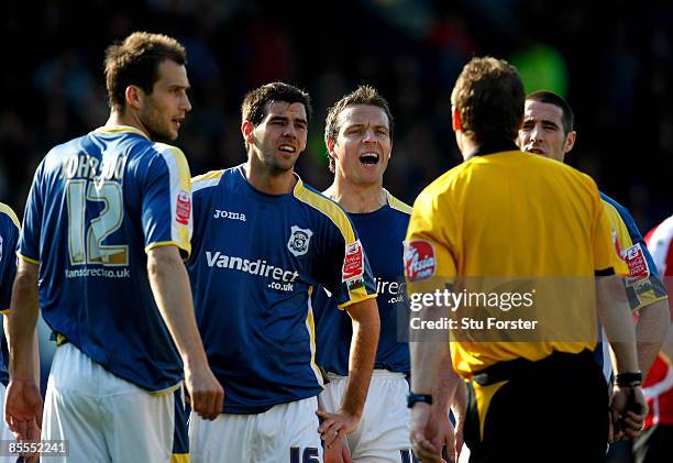 Cardiff City players led by captain Joe Ledley after Gabor Gyepes had been sent off by referee Mr Paul Taylorafter he had sent him off for a foull on...