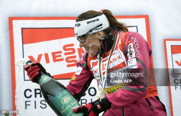 Slovenia�s Petra Majdic sprays champagne after winning the overall sprint cup in the Cross Country skiing World Cup in Falun, Sweden, on March 22,...