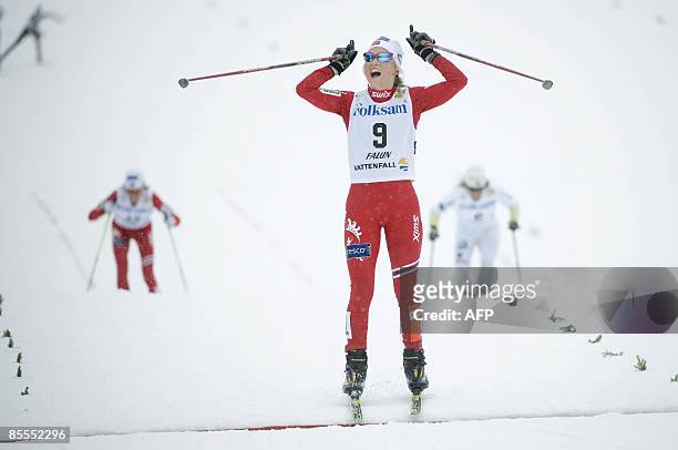 Norway's Therese Johaug reacts when crossing the finish line as number 2 in the women's 10 km during the cross country skiing world cup in Falun, on...