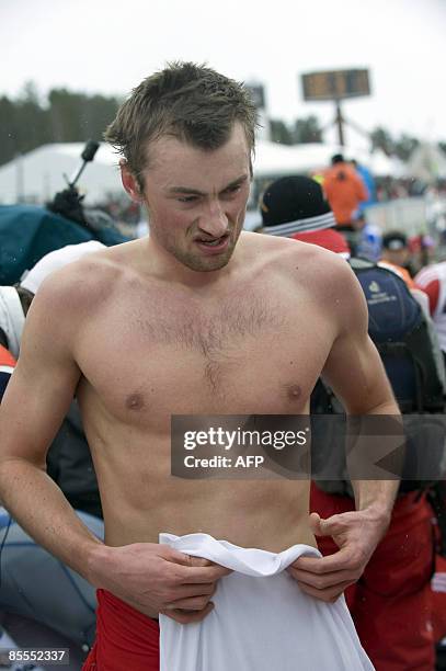 Norway's Petter Northug is pictured without his T-shirt after the men's 15 km pursuit during the Cross Country skiing world cup in Falun, on March...