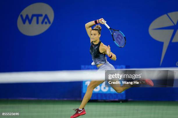 Maria Sakkari of Greece returns a shot during the match against Caroline Garcia of France on Day 6 of 2017 Dongfeng Motor Wuhan Open at Optics Valley...