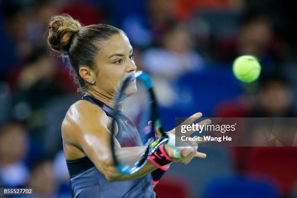 Maria Sakkari of Greece returns a shot during the match against Caroline Garcia of France on Day 6 of 2017 Dongfeng Motor Wuhan Open at Optics Valley...
