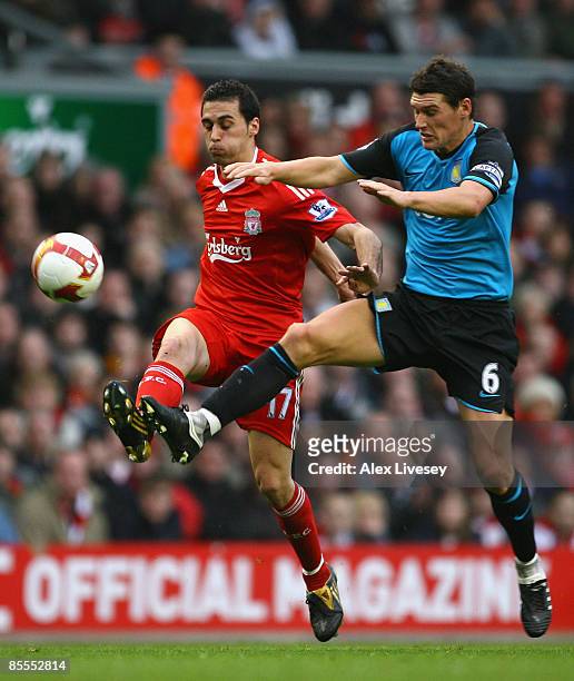 Gareth Barry of Aston Villa battles for the ball with Alvaro Arbeloa of Liverpool during the Barclays Premier League match between Liverpool and...