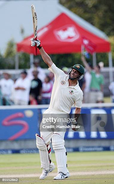 Mitchell Johnson of Australia celebrates his century during day four of the Third Test between South Africa and Australia played at Newlands on March...