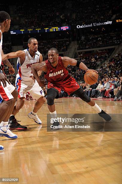 Dwyane Wade of the Miami Heat tries to lose the defending Arron Afflalo of the Detroit Pistons in a game at the Palace of Auburn Hills on March 22,...