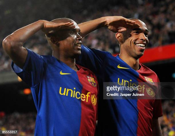Samuel Eto'o of Barcelona salutes the crowd with his team mate Thierry Henry as he celebrates scoring his side's sixth goal during the La Liga match...