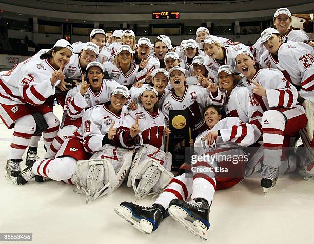 The Wisconsin Badgers pose with the championship trophy on March 22, 2009 during the NCAA Women's Frozen Four Championship game at Agganis Arena in...