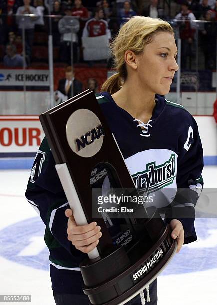 Meghan Agosta of the Mercyhurst Lakers takes the second place trophy back to her team on March 22, 2009 during the NCAA Women's Frozen Four...