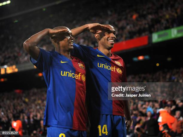 Samuel Eto'o of Barcelona salutes the crowd with his teammate Thierry Henry celebrating scoring his sides sixth goal during the La Liga match between...