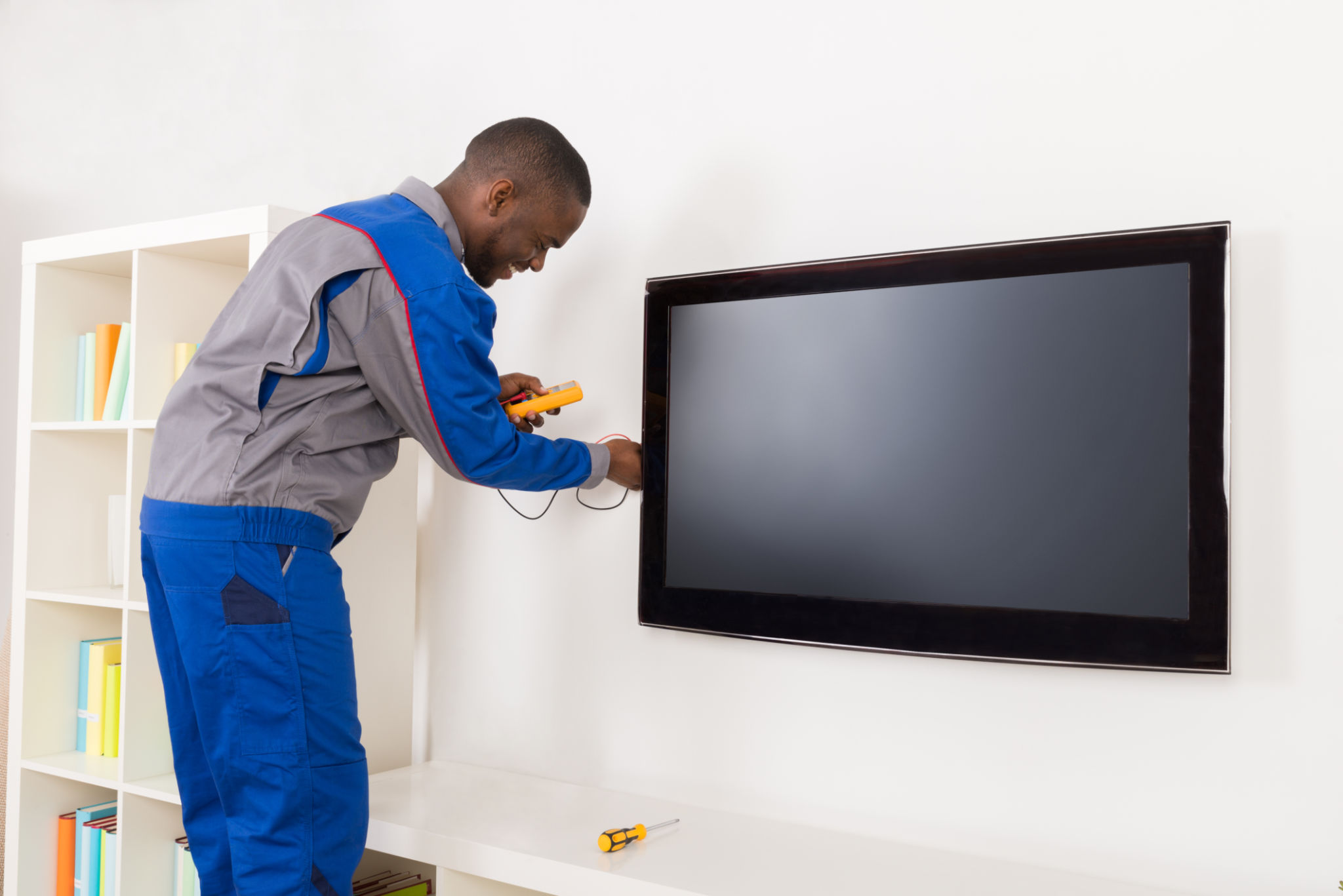 technician installing tv