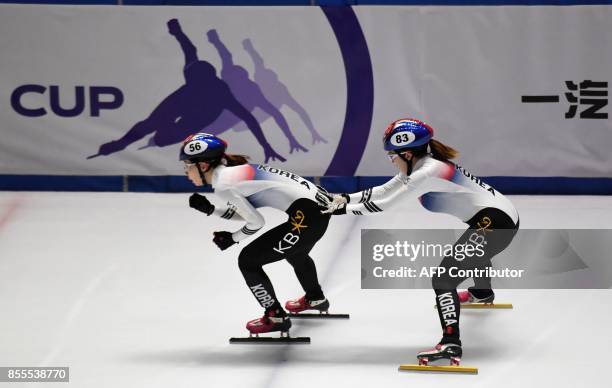 South-Korean Ye Jin Kim and Ah Reum Noh change during the ISU World Cup Short Track in BOK Hall of Budapest on September 29, 2017 during their...