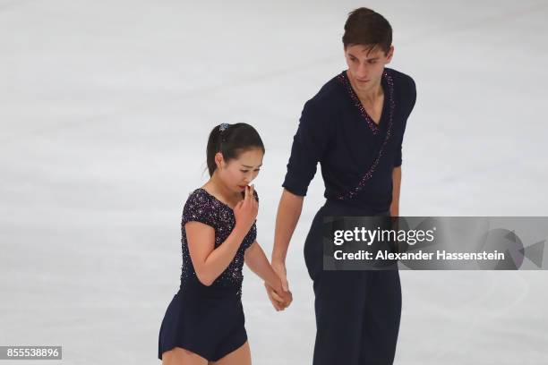 Sumire Suto and Francis Boudreau-Audet of Japan racts after performing at the Pairs free skating during the 49. Nebelhorn Trophy 2017 at Eishalle...