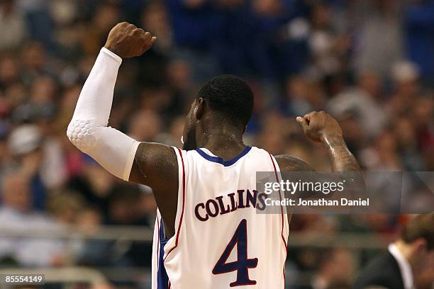 Sherron Collins of the Kansas Jayhawks celebrates as he comes out of the game in the final minutes of Kansas' 60-43 win against the Dayton Flyers...