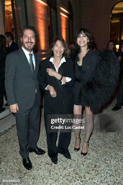 Guillaume Gallienne, Jane Birkin and Charlotte Gainsbourg attend the Opening Party at Yves Saint Laurent Museum as part of the Paris Fashion Week...