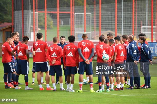 Interim coach Willy Sagnol of FC Bayern Muenchen talks to his team during a training session at Saebener Strasse training ground on September 29,...