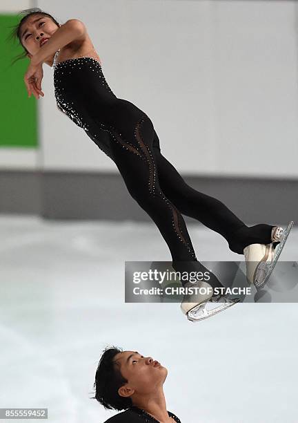 Ryom Tae-Ok and Kim Ju-Sik of North Korea perform during their pairs free skating program of the 49th Nebelhorn trophy figure skating competition in...