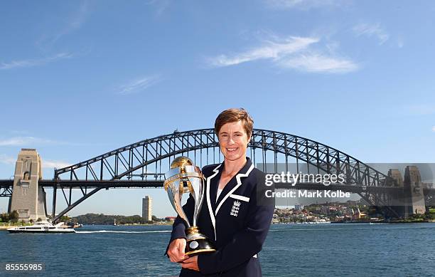 Player of the tournament Claire Taylor of England poses with the ICC Women's World Cup 2009 trophy at the Opera House overlooking Sydney Harbour on...