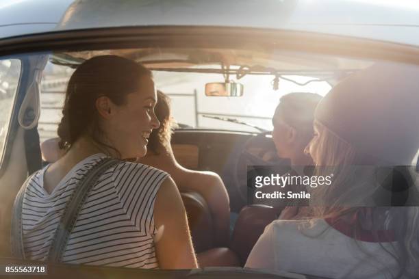 group of friends chatting in a car - four people in car fotografías e imágenes de stock