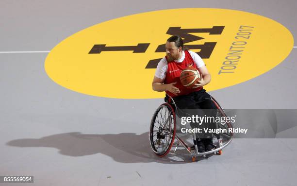 Jakob Hou Larsen of Denmark dribbles the ball in a Wheelchair Basketball pool match against New Zealand during the Invictus Games 2017 at Toronto Pan...