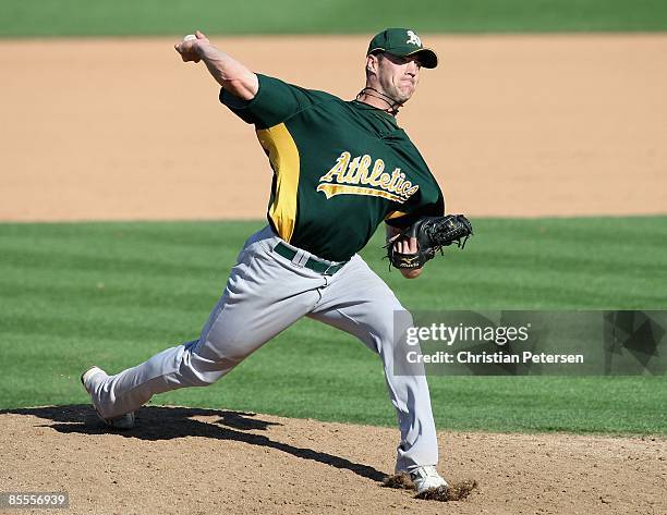 Relief pitcher Jeff Gray of the Oakland Athletics pitches against the San Diego Padres during the spring training game at Peoria Stadium on March 7,...