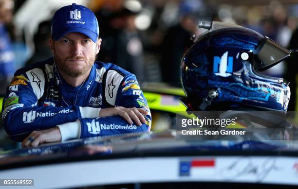 Dale Earnhardt Jr., driver of the Nationwide Chevrolet, looks on during practice for the Monster Energy NASCAR Cup Series Apache Warrior 400...