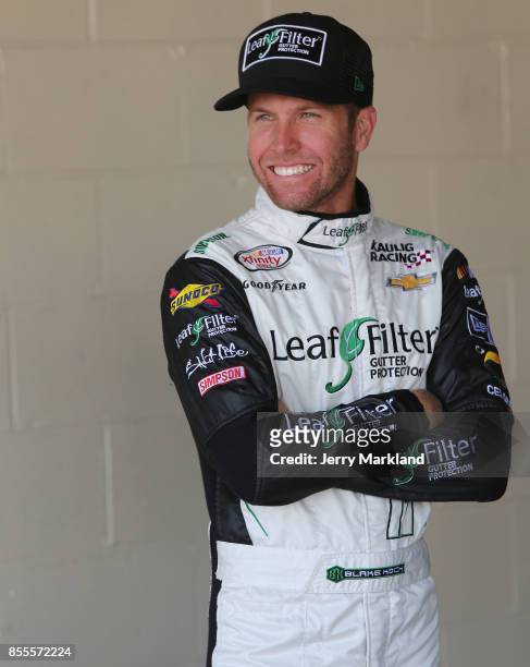 Blake Koch, driver of the LeafFilter Gutter Protection Chevrolet, looks on during practice for the NASCAR XFINITY Series "Use Your Melon. Drive Sober...
