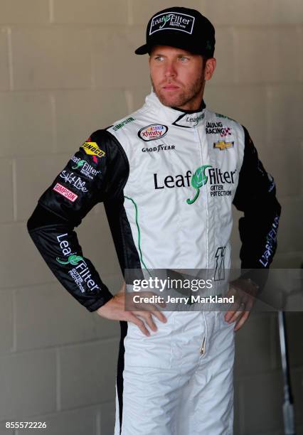 Blake Koch, driver of the LeafFilter Gutter Protection Chevrolet, looks on during practice for the NASCAR XFINITY Series "Use Your Melon. Drive Sober...